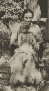 Eunice Chapman Snyder holding Thad Allen Snyder at homestead near Miami, OK